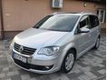 VOLKSWAGEN TOURAN 2.0 PD TDI Highline DSG DPF NAVIGÁCIÓ/VONÓHOROG/TEMPOMAT/ÜLÉS FŰTÉS
